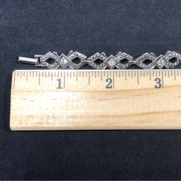 BRACELET - SILVER-TONE WITH 7 RHINESTONES EACH SET IN A SQUARE SETTING - Picture 15 of 16